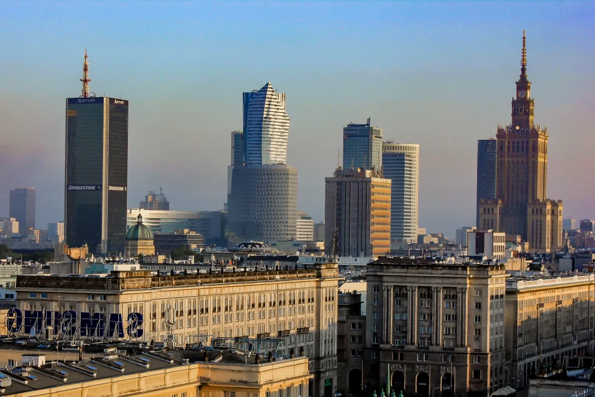 Palace of Culture and Science glowing in late light among the Warsaw skyline